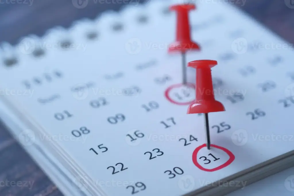 Key Calendar Highlights Featuring Red Push Pins to Mark Important Dates